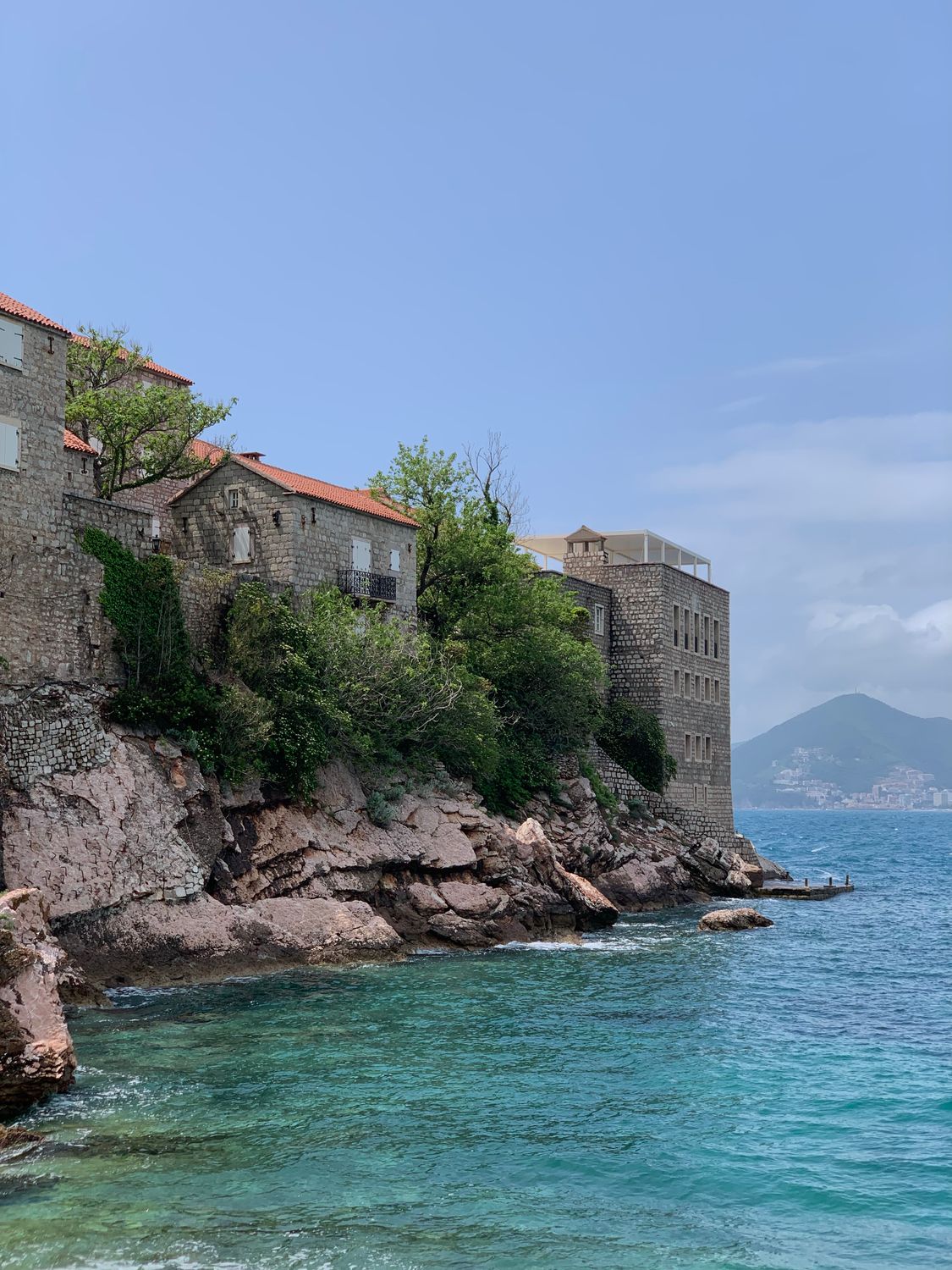 Coastal View of Historic Stone Buildings by the Sea · Free Stock Photo