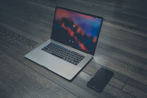 Free Macbook Pro and Space Gray Iphone 6 Stock Photo