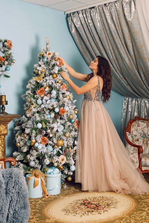 Free Woman Arranging White Christmas Tree Stock Photo
