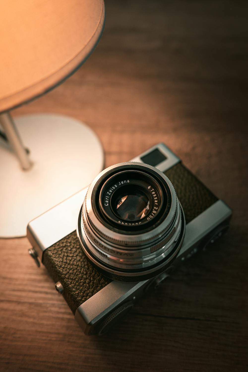 Retro Analog Camera on Vintage Wooden Desk · Free Stock Photo