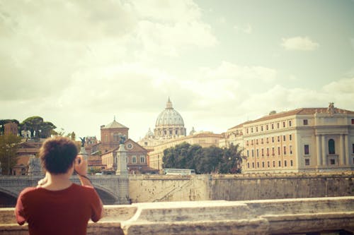 Person Taking Photo of Buildings