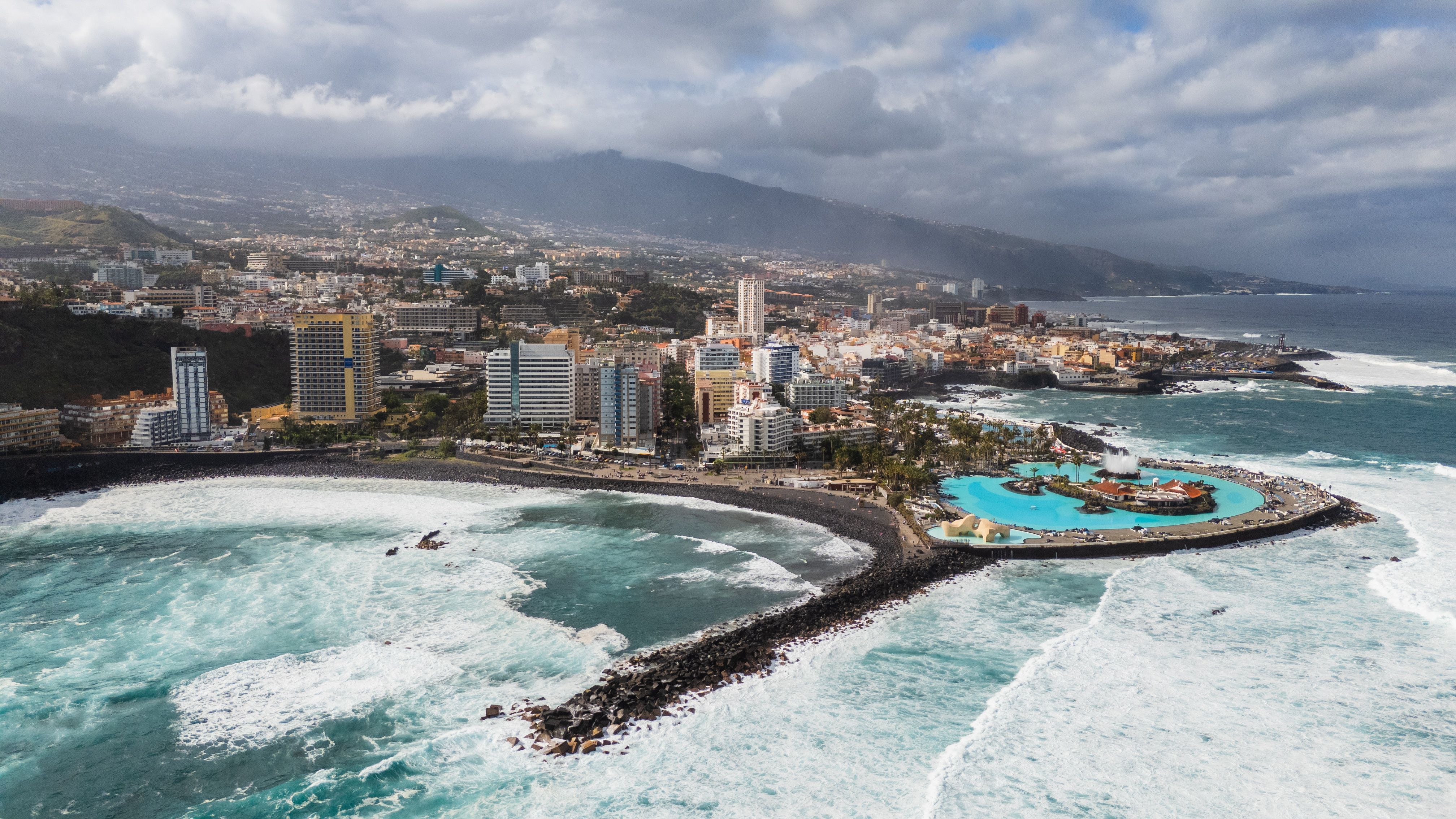 Captivating aerial shot of Puerto de la Cruz, Tenerife with ocean and cityscape.