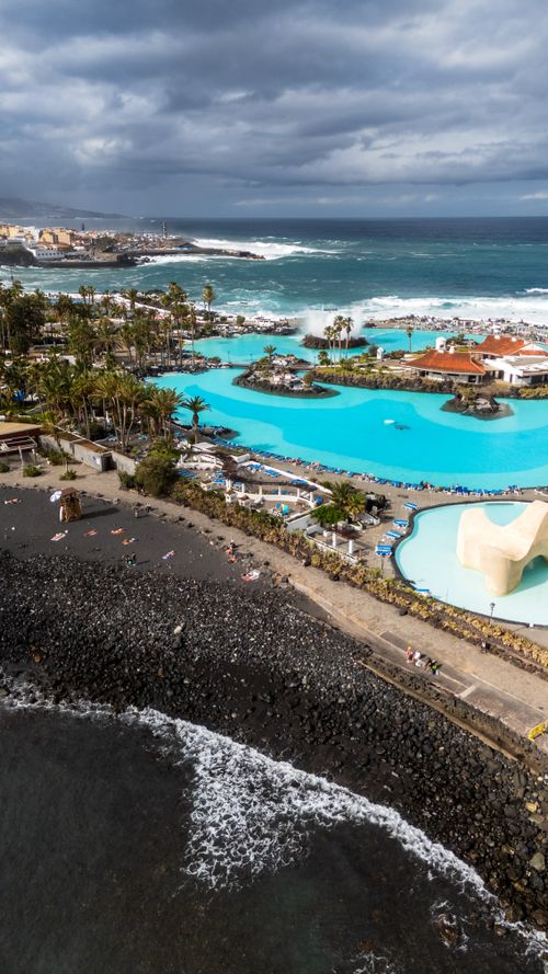 Free A stunning aerial view of Lago Martiánez with the Atlantic Ocean in Puerto de la Cruz, Canary Islands, Spain. Stock Photo