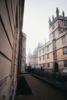 Beautiful historic architecture in Oxford, England, captured in the morning mist and soft light.