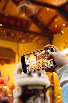 Vibrant festival scene photographed on a mobile phone, highlighting traditional celebration.