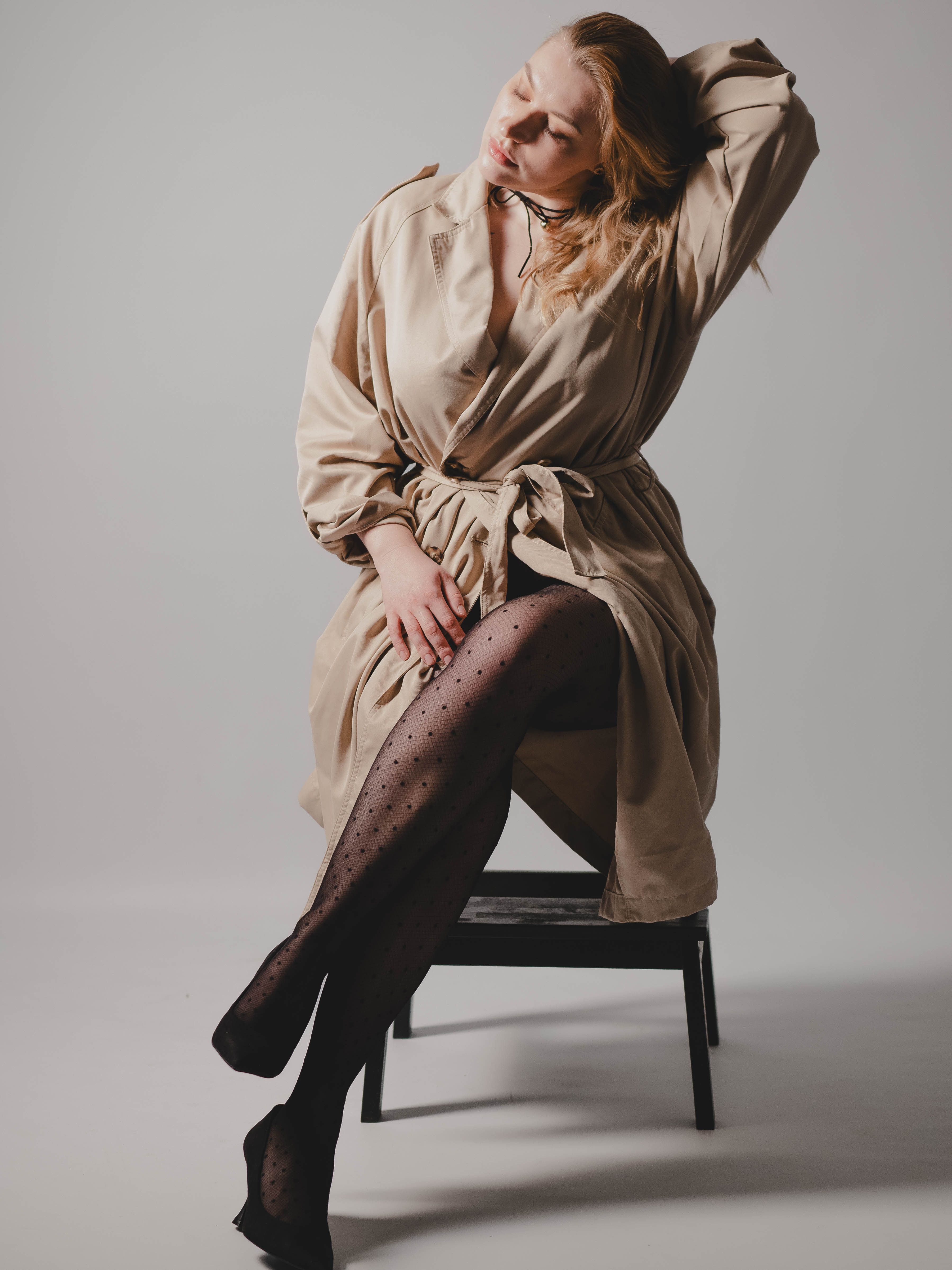 Elegant Woman in Beige Trench Coat Posing · Free Stock Photo