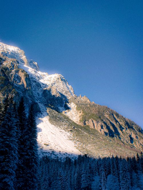 Free Breathtaking view of a snowy mountain range in Slovenia during winter. Stock Photo