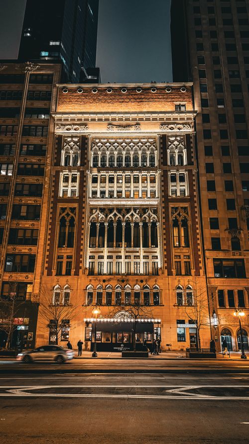 Free Stunning illuminated facade of a Neo-Gothic building in downtown Chicago at night. Stock Photo