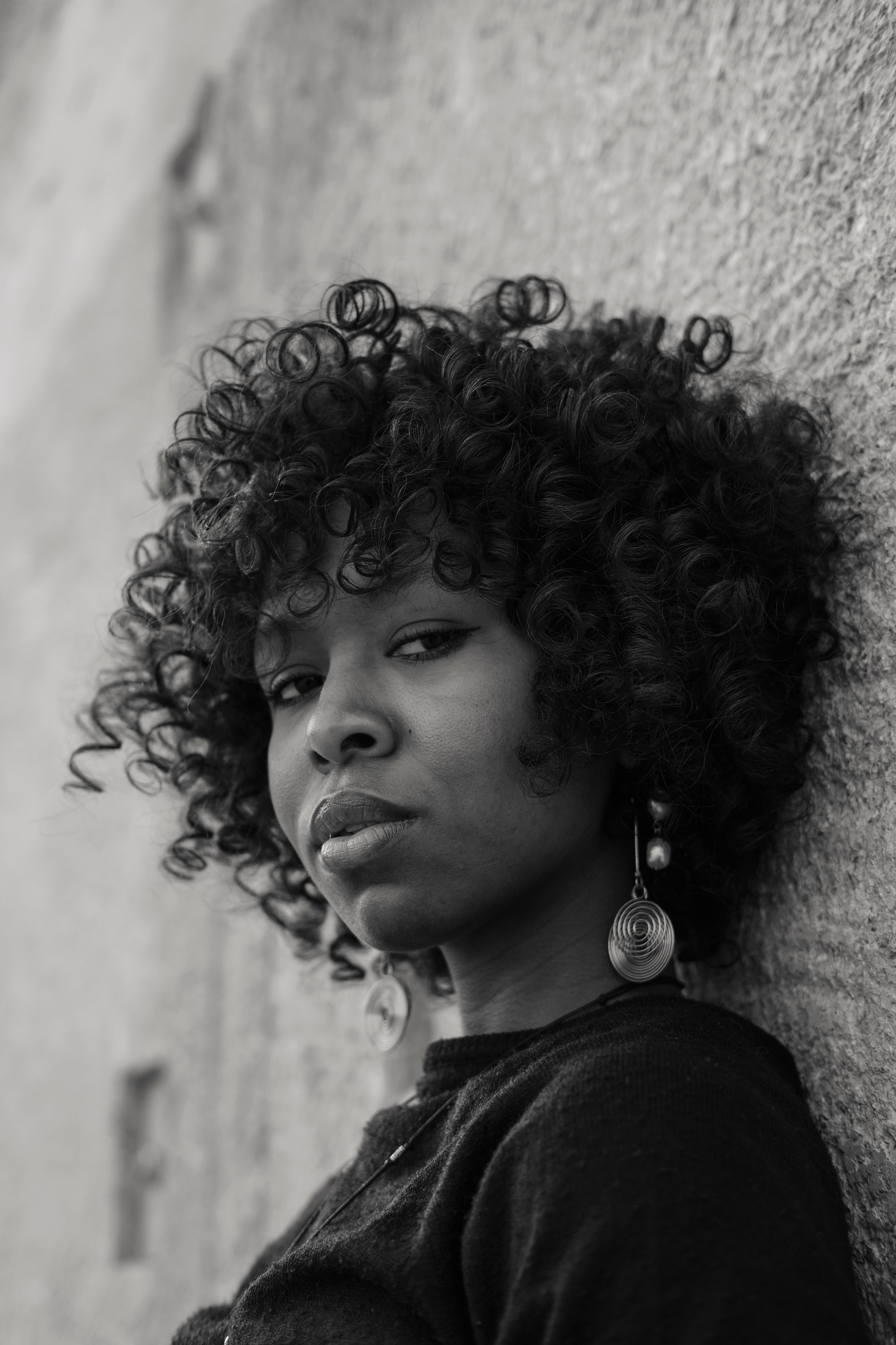 Stylish Portrait of Woman with Curly Hair in Rabat · Free Stock Photo