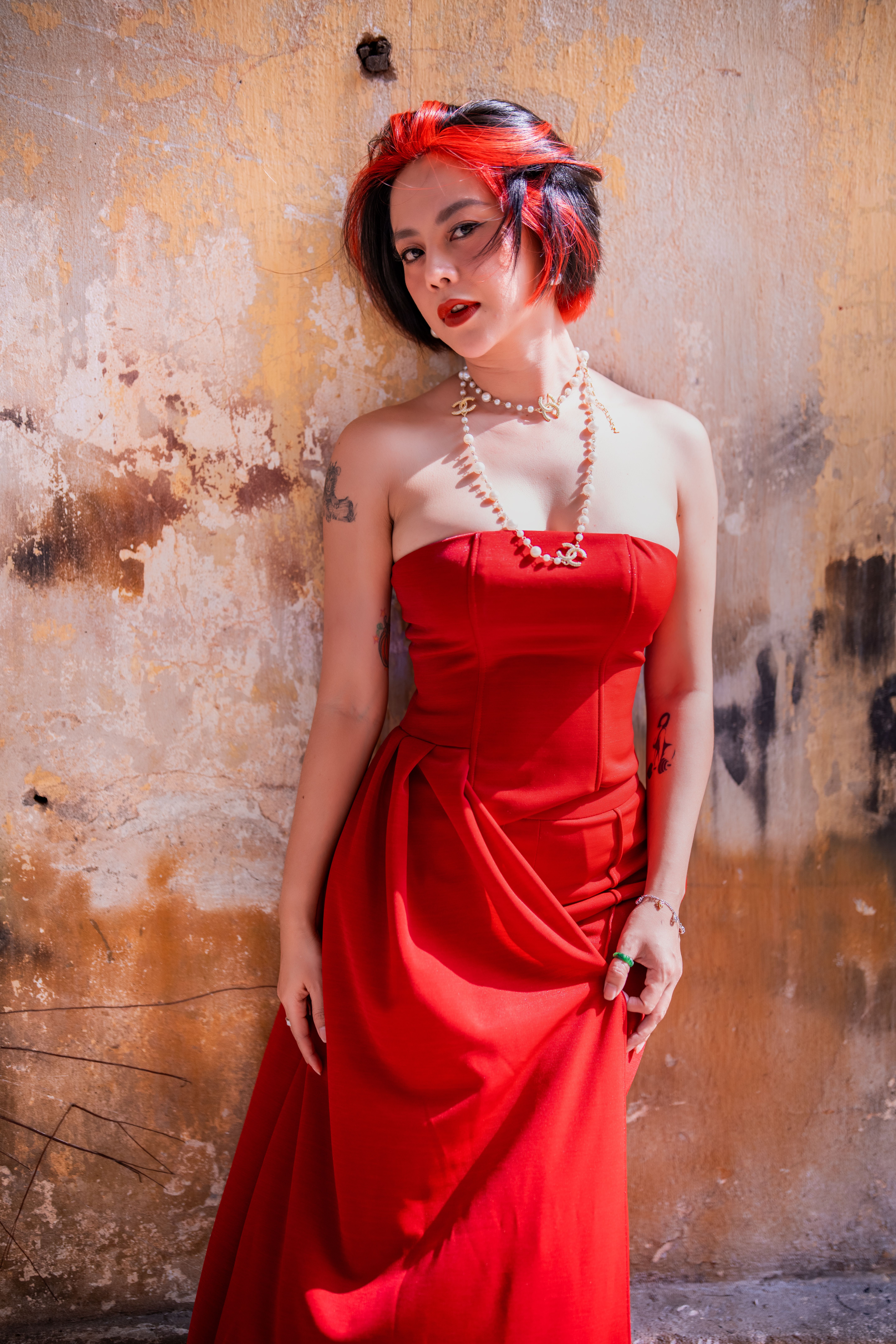 Elegant Woman in Red Dress Posing Outdoors · Free Stock Photo