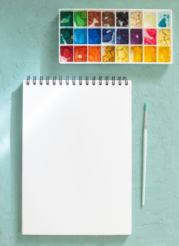 Blank sketchbook and paint set on a mint ground — Noemí Jiménez on Pexels