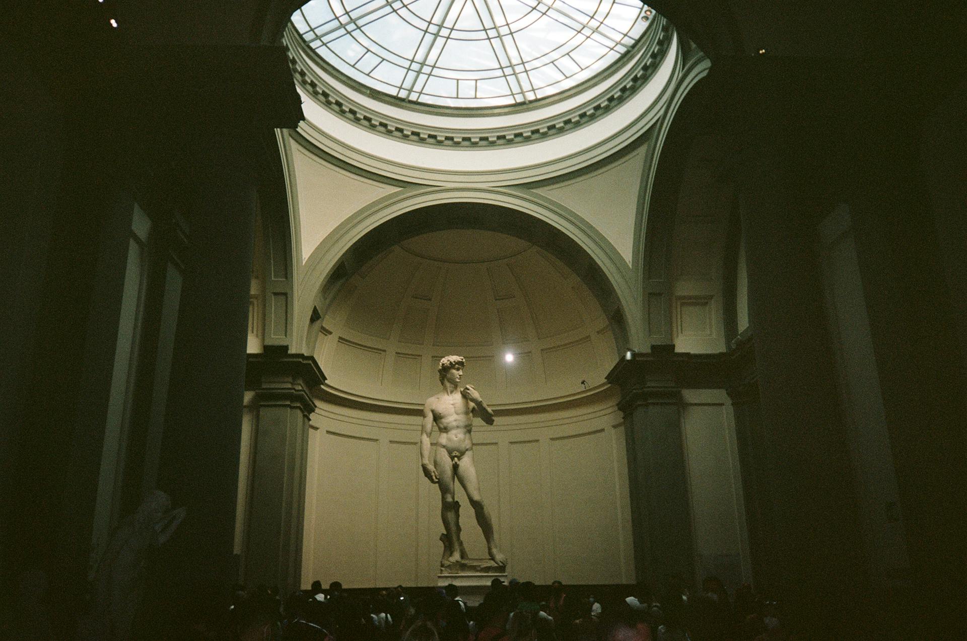 The iconic Statue of David by Michelangelo in a grand gallery, Florence, Italy.