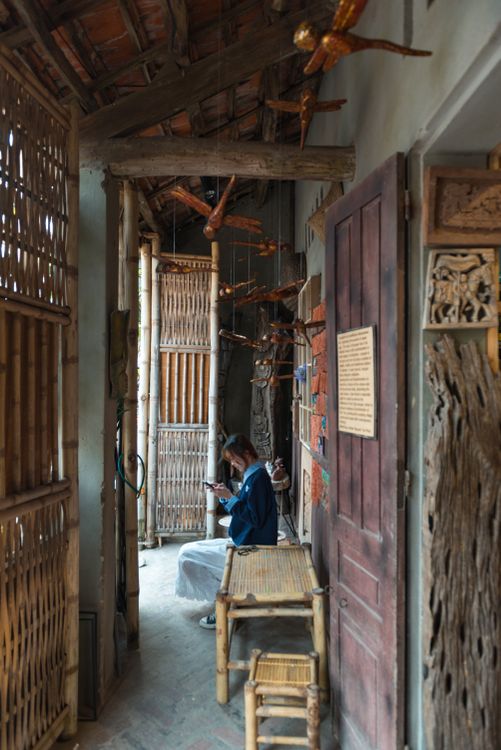 Traditional Vietnamese Interior with Person Sitting · Free Stock Photo