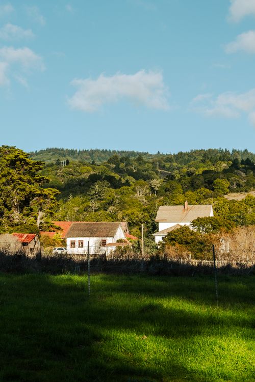 Rustic Countryside Cottages in Scenic Landscape · Free Stock Photo