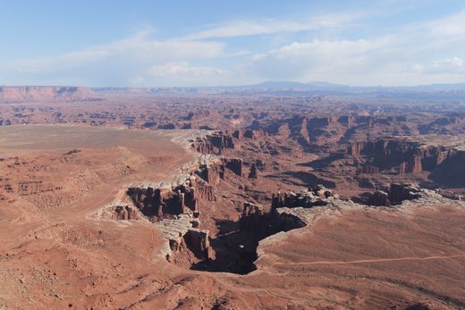 Aerial view of a rugged desert canyon landscape — photo by Ambient Vista on Pexels
