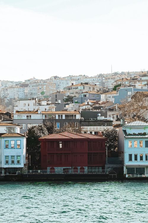 Free Beautiful view of Istanbul's colorful waterfront architecture alongside serene waters. Stock Photo