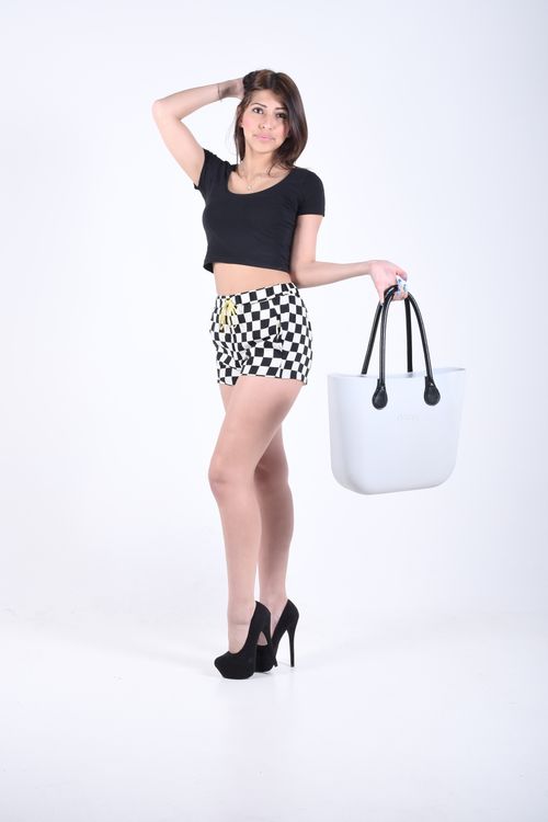 Pale tote bag carried in a studio shot — photo by Andrea Musto on Pexels