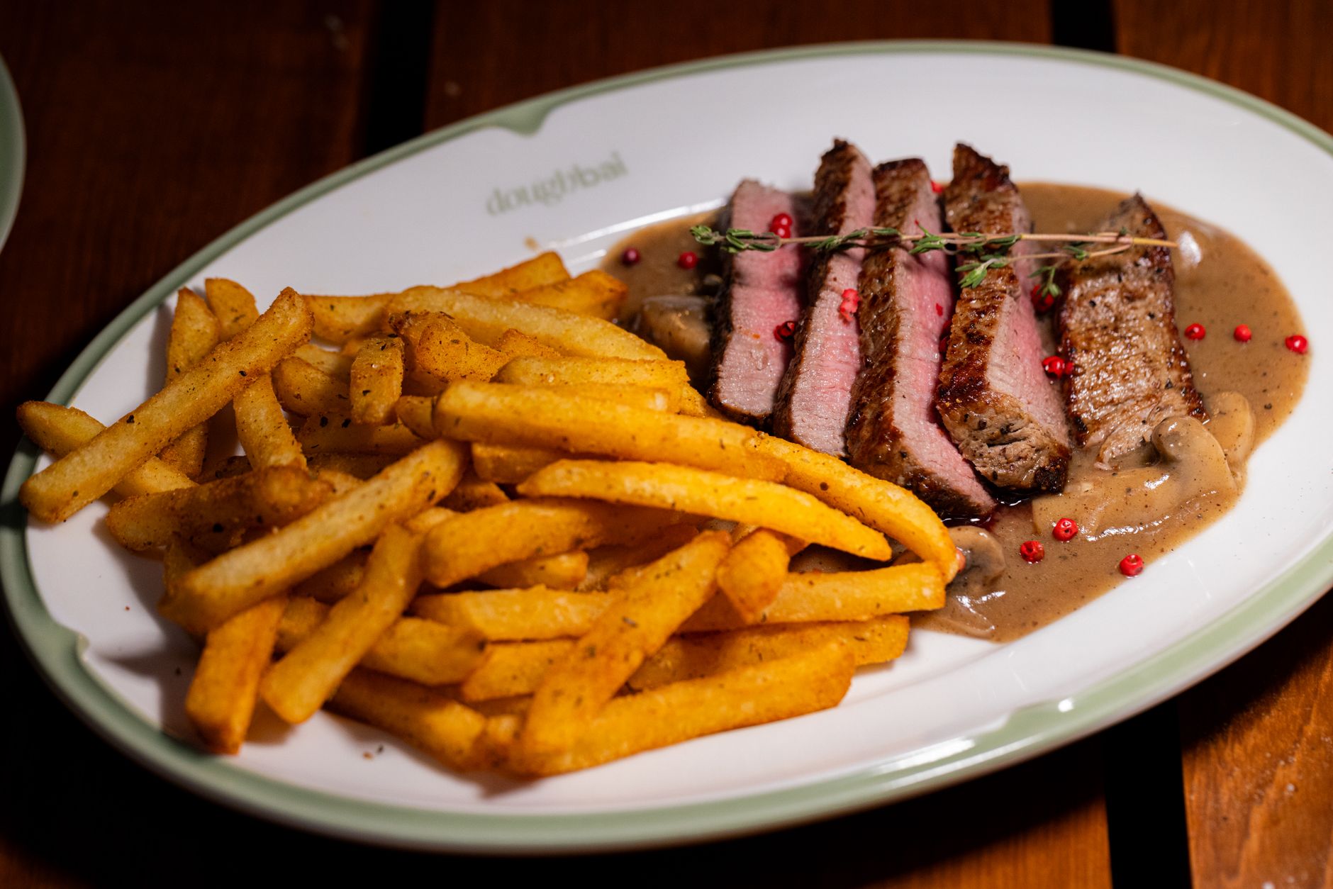 Freshly cooked steak fries served on rustic plate