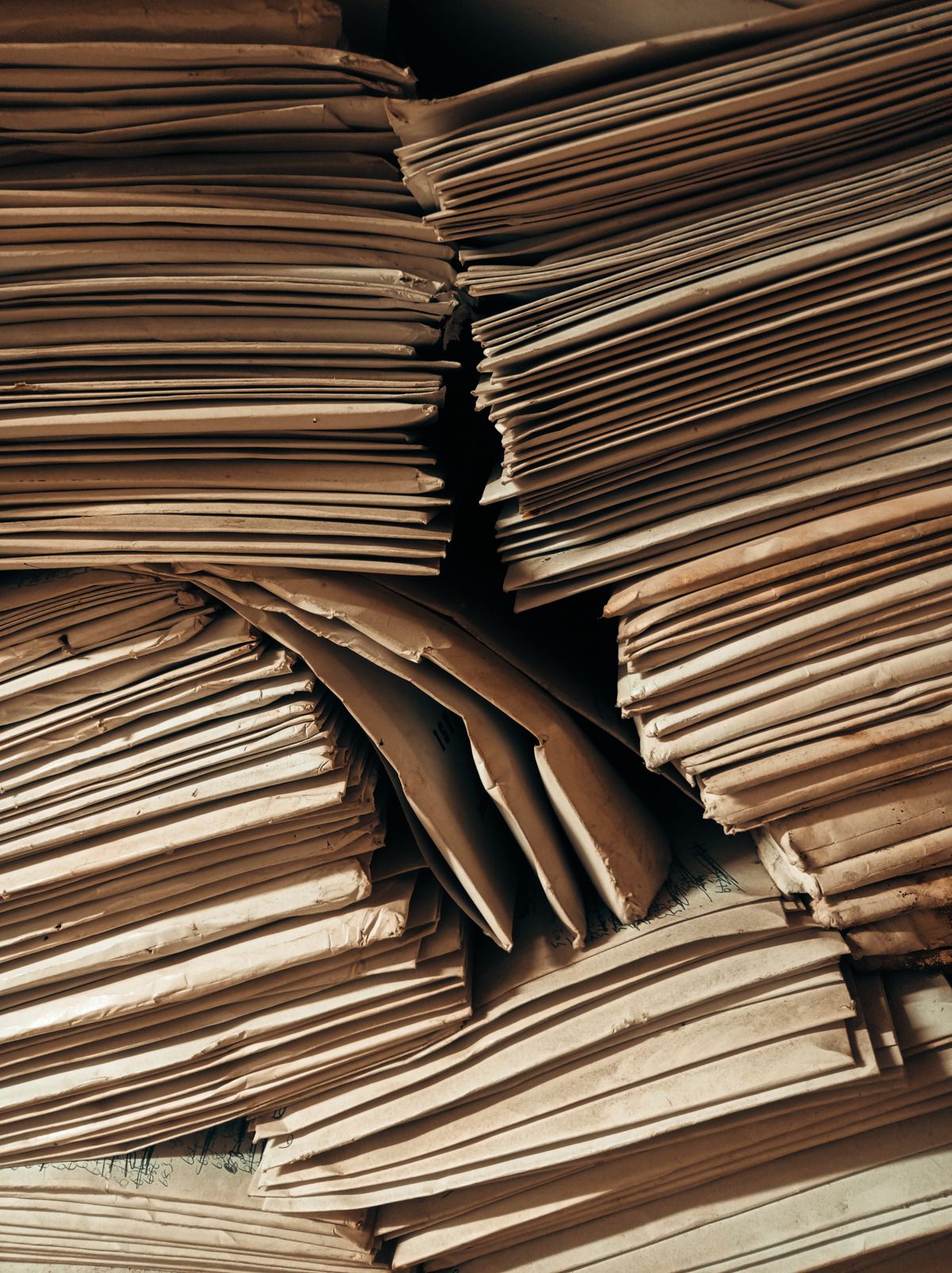 Stacked bundles of aged paper documents