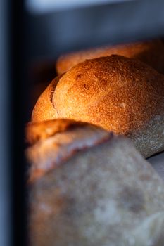 Crispy golden-brown artisan bread loaves fresh from the oven, capturing rustic texture.
