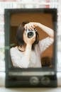 Woman Holding Camera