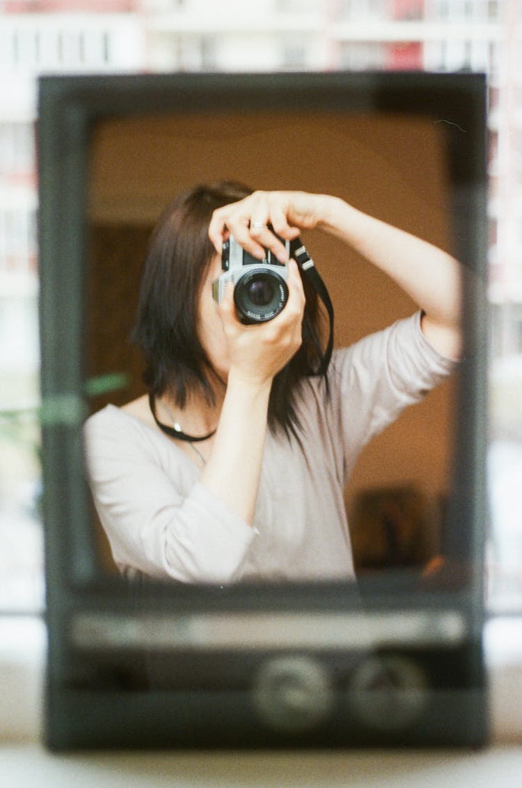 Woman Holding Camera