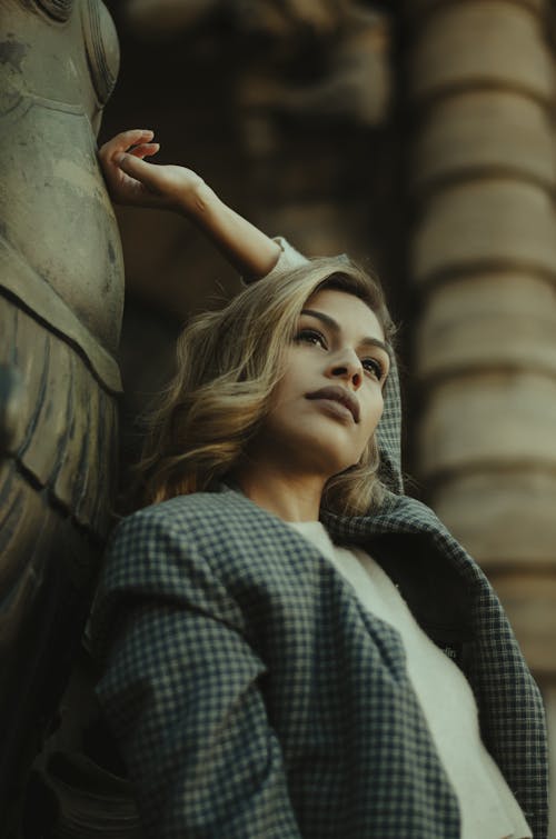 Woman Leaning on Pillar