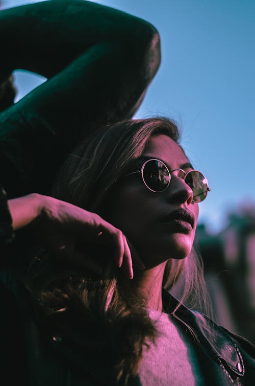 Woman Wearing Sunglasses And A Black Jacket