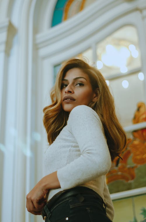 Woman Wearing White Long Sleeved Top