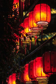 A captivating view of glowing Chinese lanterns illuminating the night street.