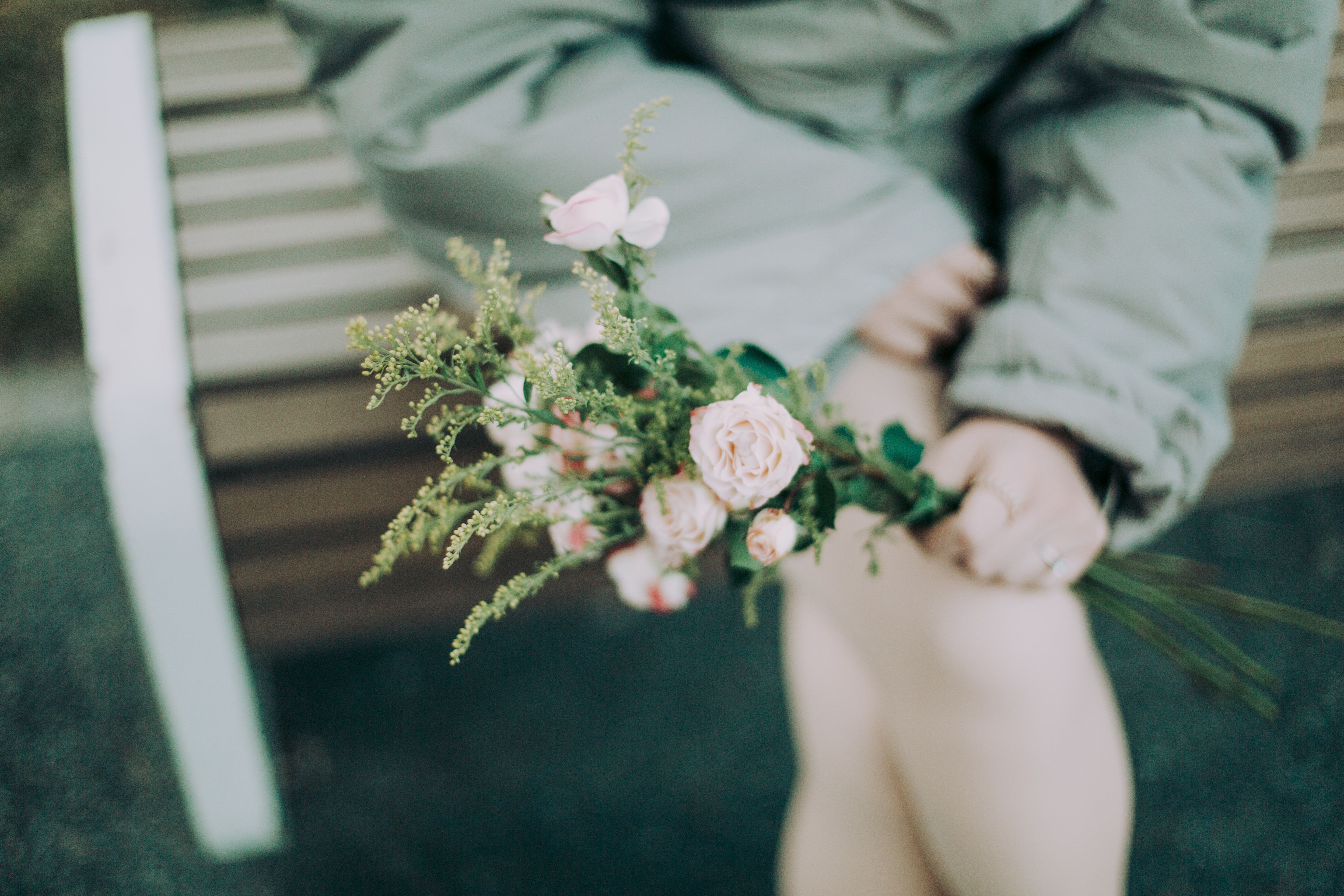 Woman Holding Bouquet of Pink Roses on Bench · Free Stock Photo