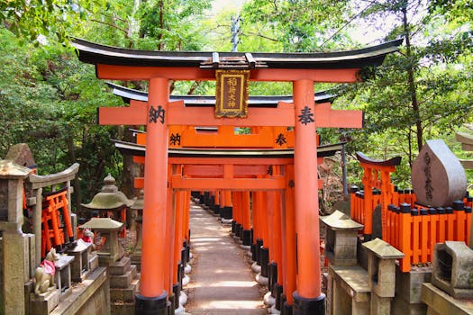 Explore the vibrant torii gates of Fushimi Inari Shrine in Kyoto, a serene and iconic landmark.
