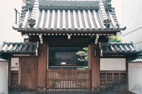 Free Wooden gate with traditional tiled roof in historic Kyoto, Japan. Stock Photo