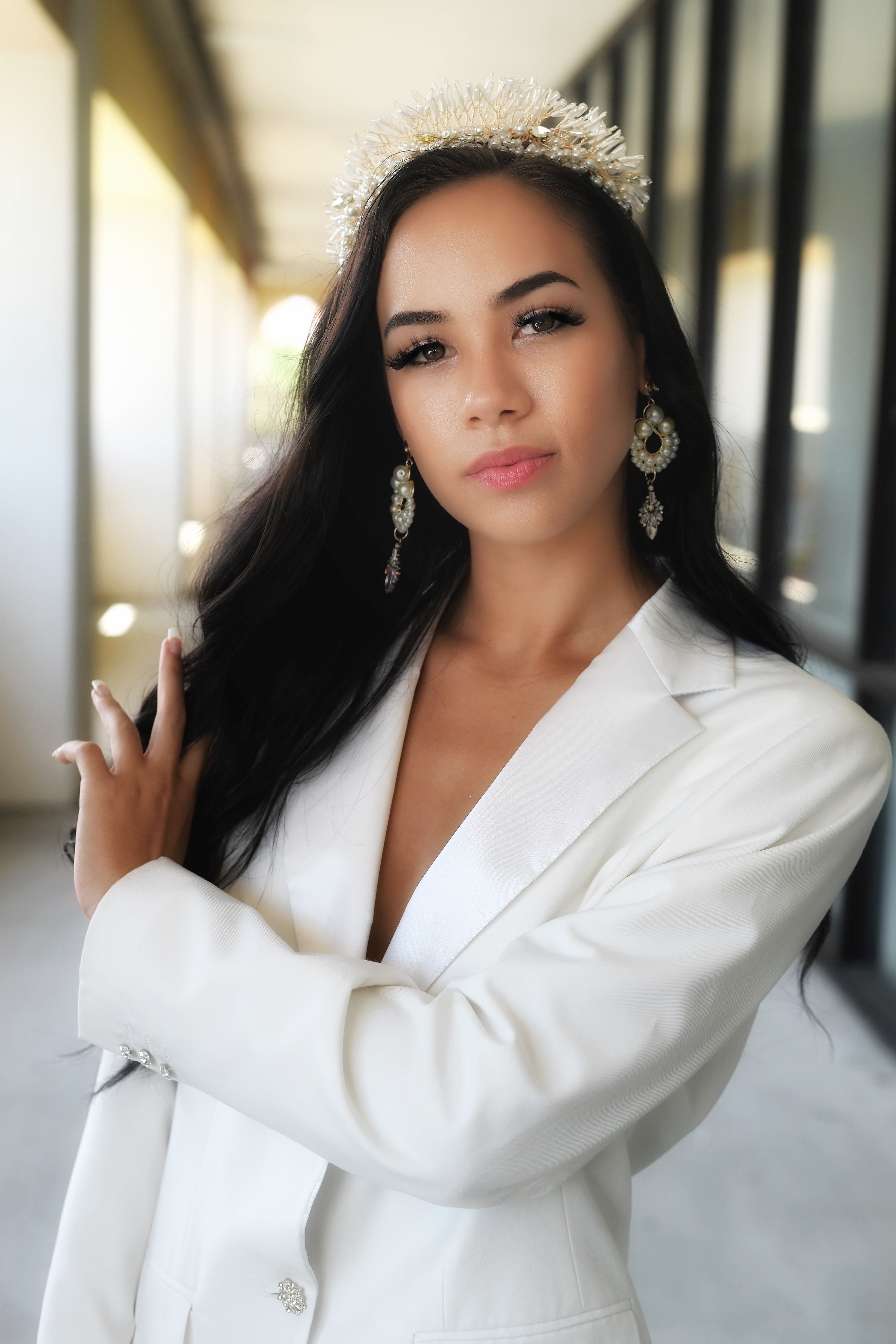 Elegant Woman in White Blazer with Jewels · Free Stock Photo