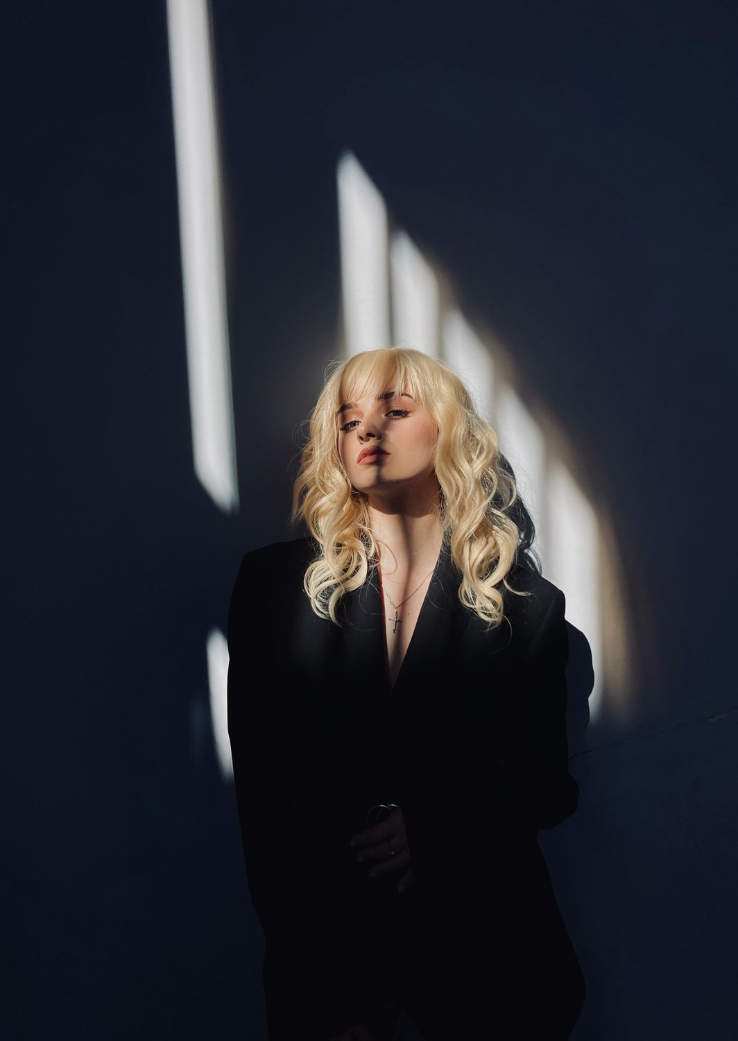 Dramatic Portrait of Woman in Dark Setting · Free Stock Photo