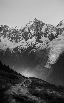 Stunning black and white photograph of the Chamonix mountains under a moody sky.