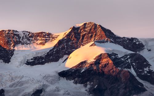 Free Majestic mountain peaks glowing in sunset light with snow and glaciers. Stock Photo