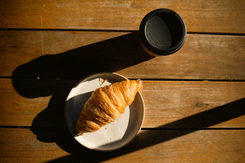 Takeaway flat white prepared at Grounded Coffee Co. in Melbourne
