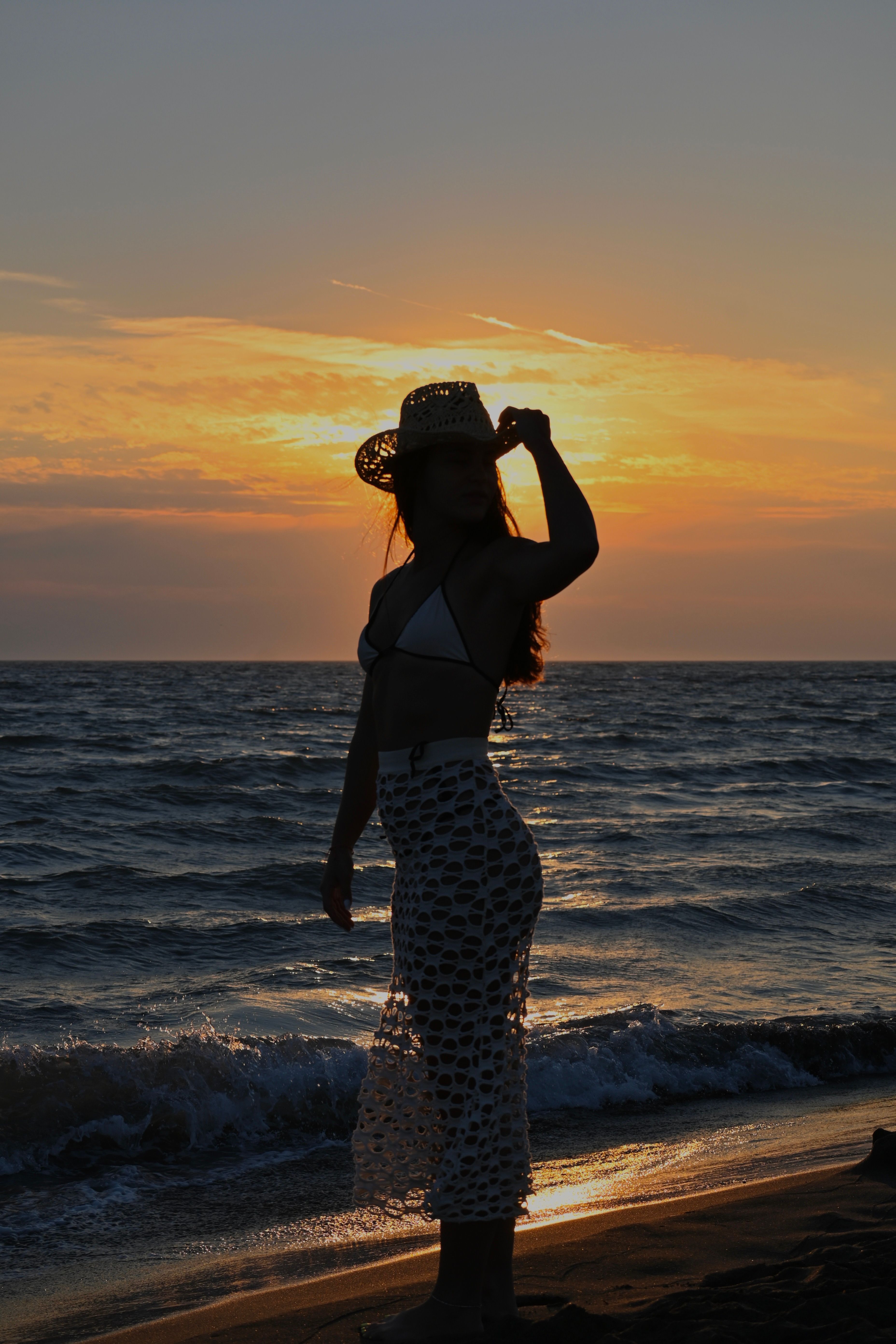 Silhouette of Woman on Beach at Sunset · Free Stock Photo