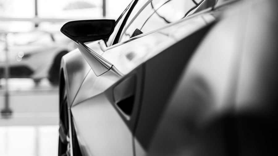 Close view along the mirror and side glass of a performance car