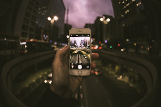 A dynamic cityscape captured through a smartphone, showcasing urban life at dusk.