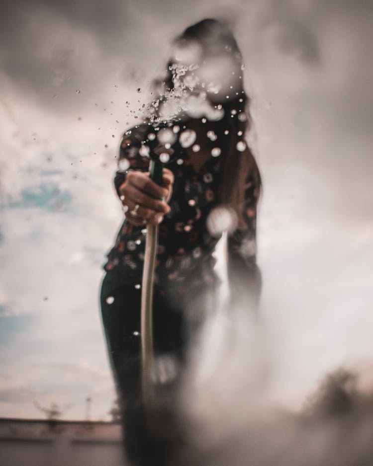 Woman Holding Pressure Washer Nozzle