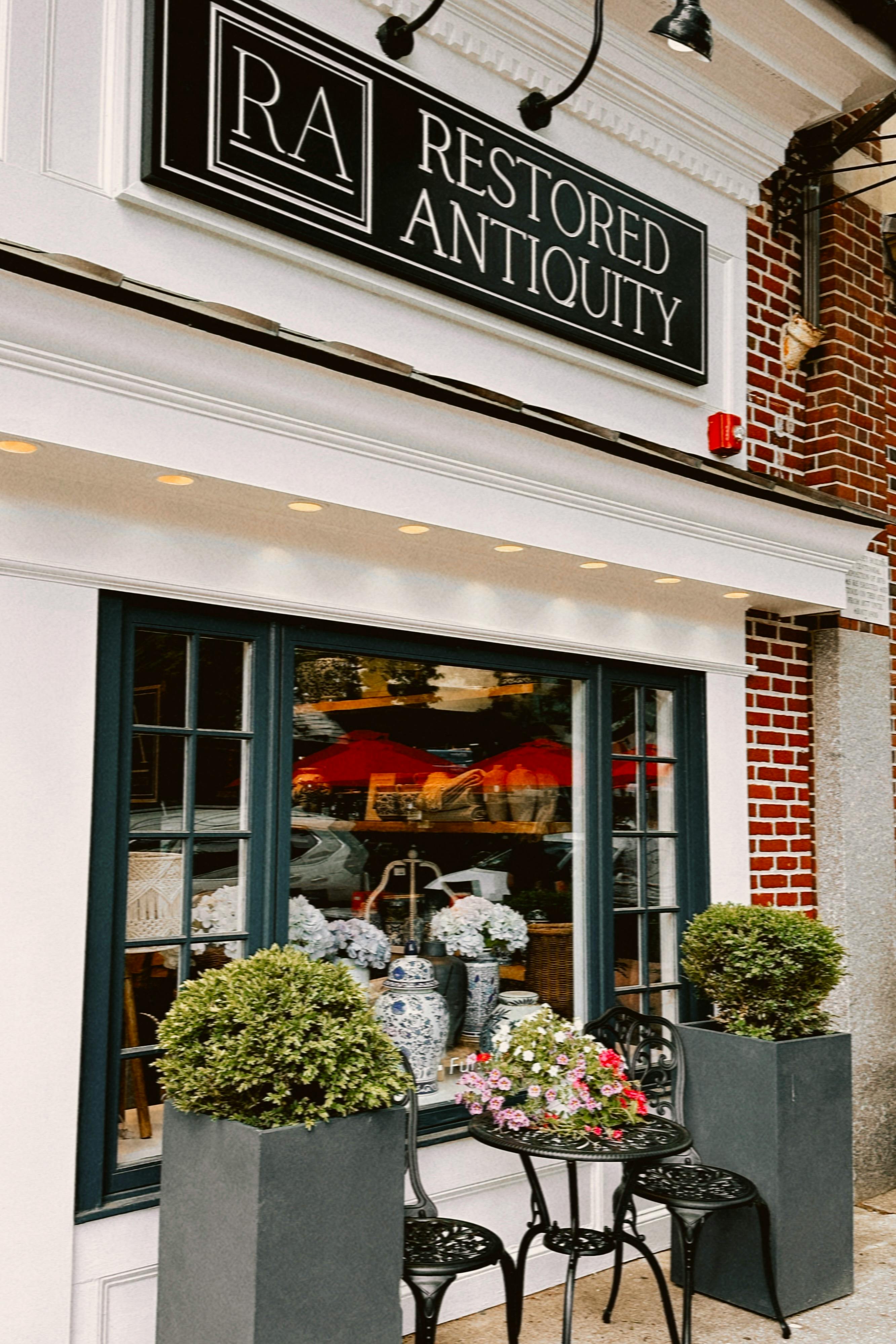 Charming Antique Shopfront with Outdoor Decor · Free Stock Photo