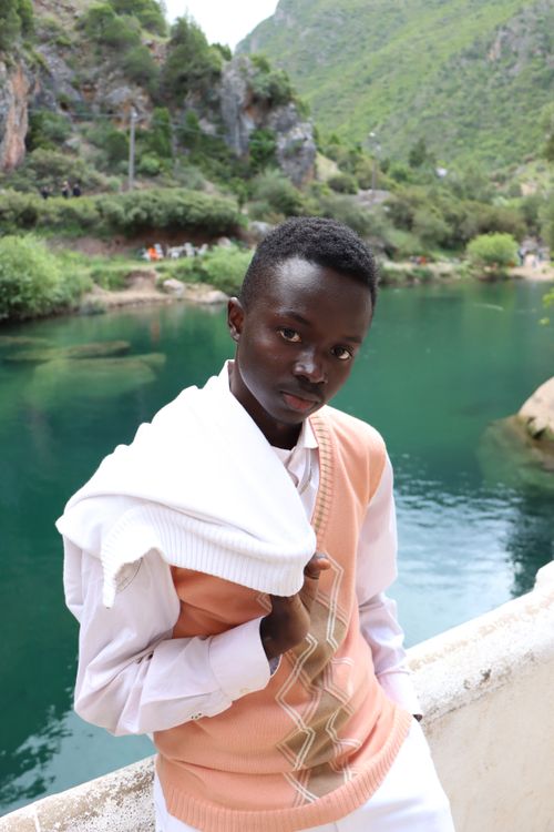 Free Stylish portrait by the picturesque Akchour waterfall in Morocco, capturing natural beauty. Stock Photo