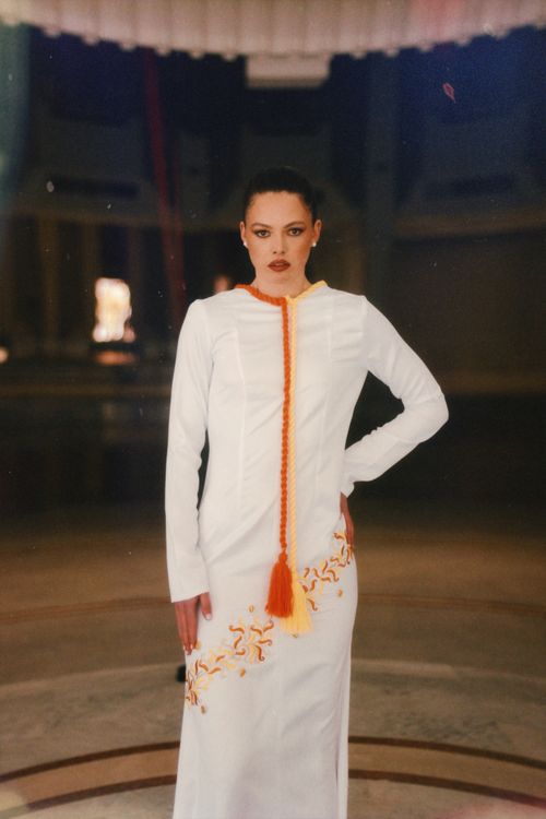Free Stylish portrait of a woman in white attire, captured in Marrakesh's unique indoor setting. Stock Photo