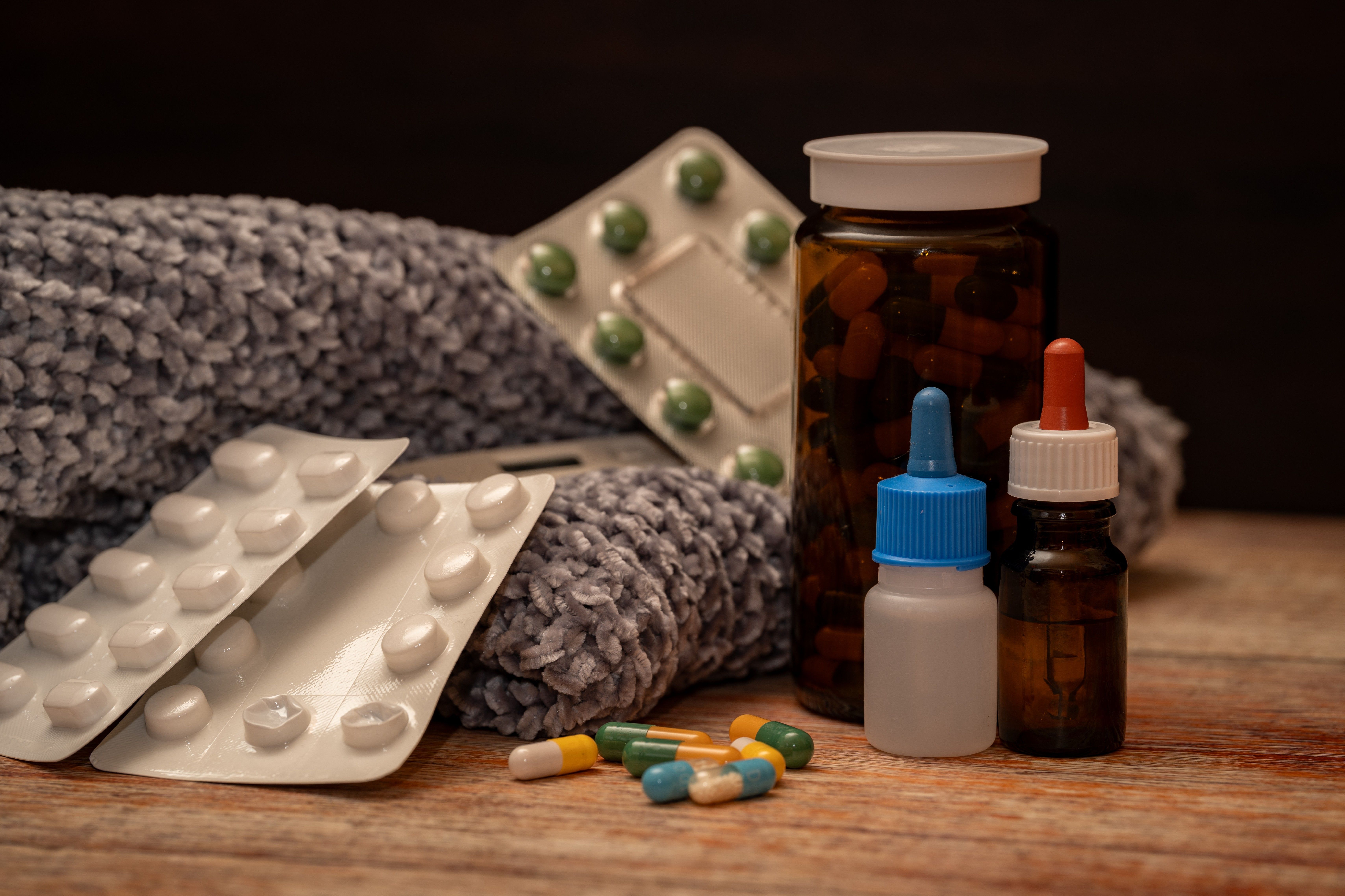 Collection of Cold Remedies on Wooden Surface · Free Stock Photo