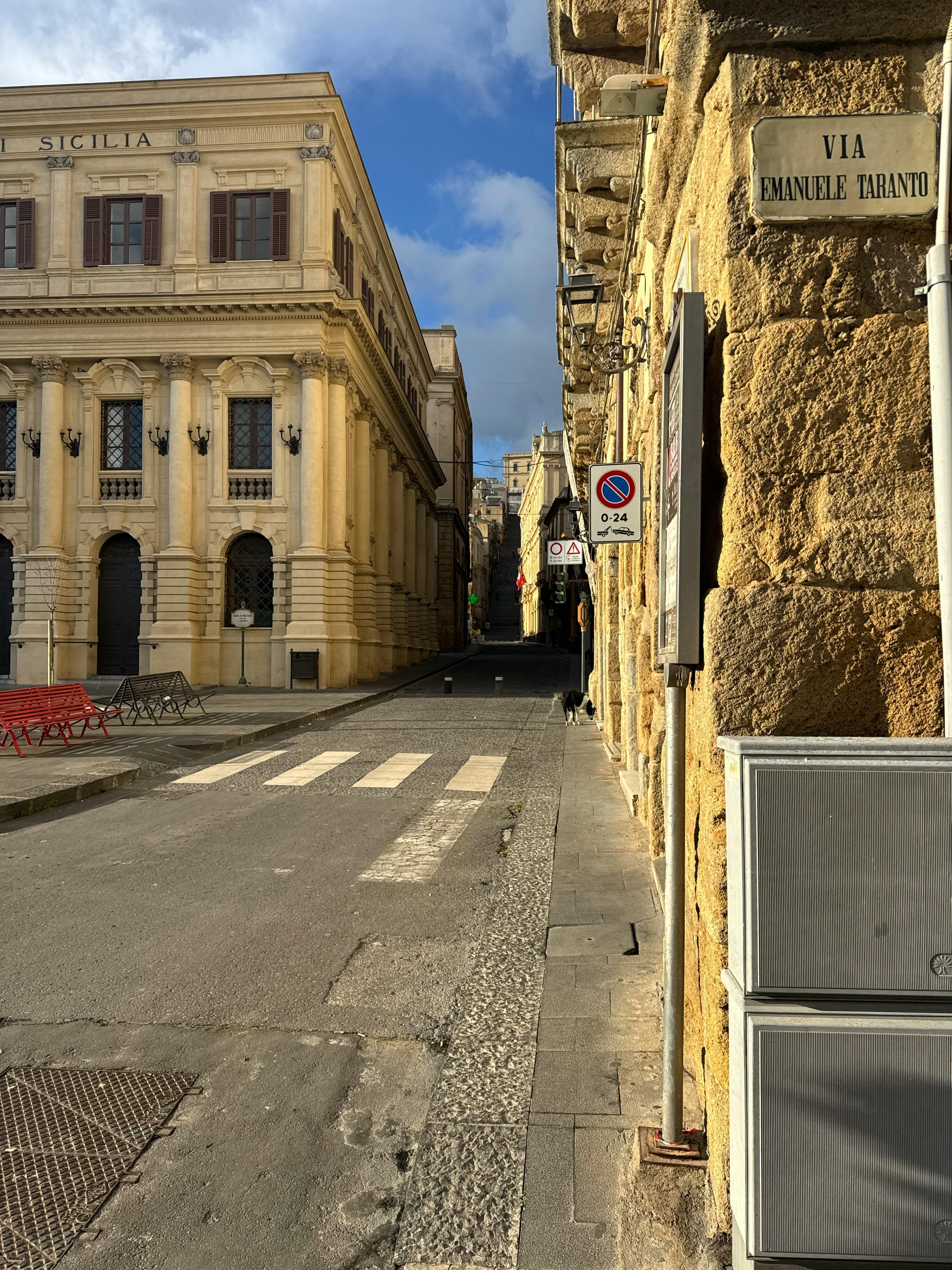 Charming street in Sicily, Italy showcasing historic architecture and serene atmosphere.