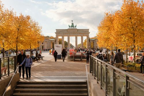 Free Crowds enjoying a sunny autumn day at Brandenburg Gate, Berlin. Stock Photo