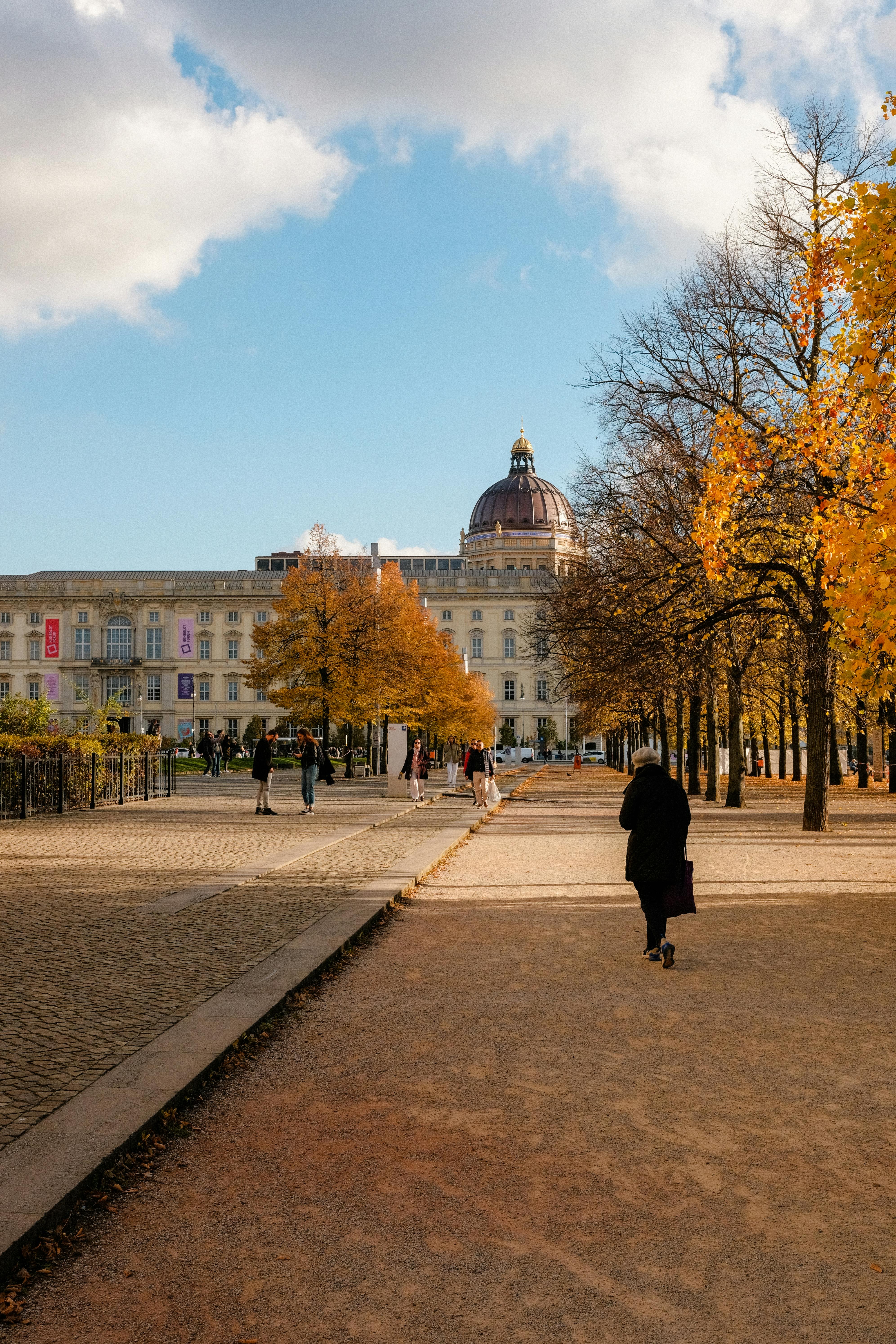 Stunning autumn day on Museum Island, Berlin with golden trees and historic architecture.