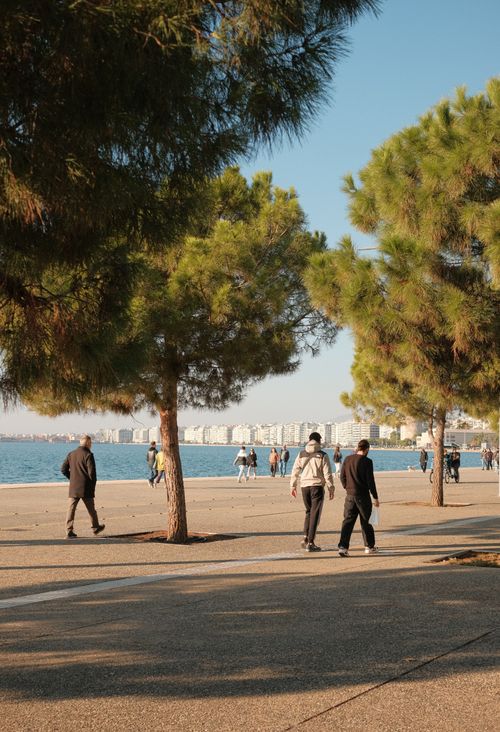 Free People enjoying a leisurely walk along the beautiful seafront in Thessaloniki, Greece. Stock Photo